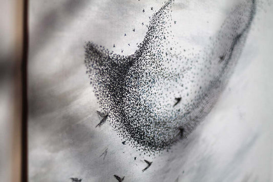 'Let the sky take hold of your breath' original starling murmuration painting. Grey and blue and brown watercolour and natural ink wash background with tiny black ink and watercolour birds in a starling murmuration.